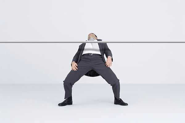 Business man doing the limbo